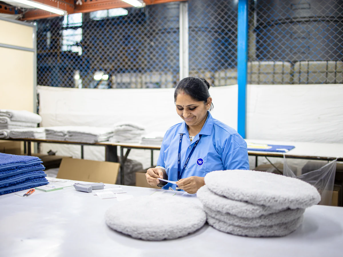 Factory specialist reviewing a pet product on the production line